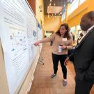 UC Davis CLEAR Center Ph.D. student Alice Rocha shares her research with United Nations Food and Agriculture Organization Livestock Policy Officer, Aimable Uwizeye, at the State of the Science Summit - Feed Strategies to Reduce Enteric Emissions. The event was held at UC Davis on May 2 and 3, 2023. 